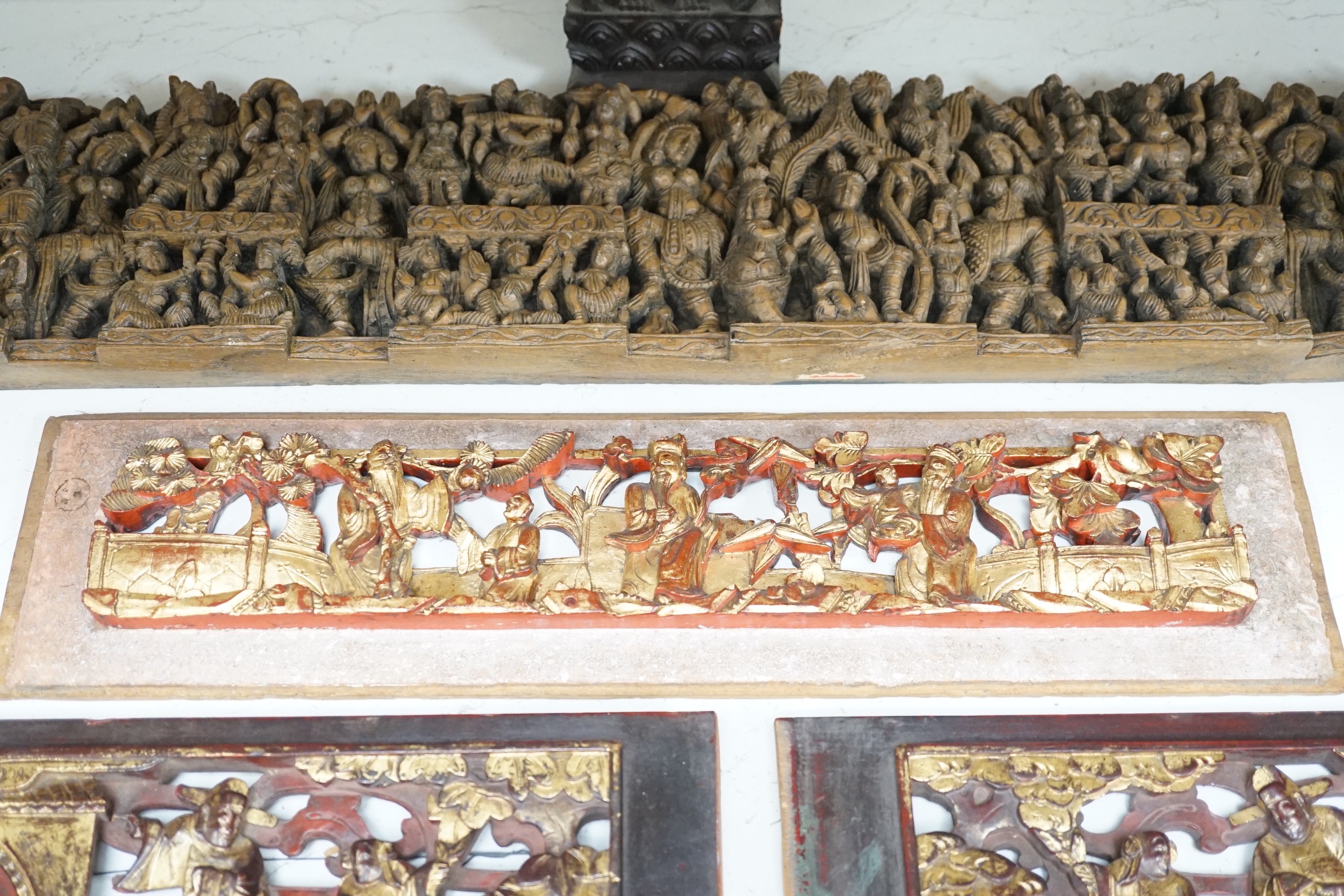 Two South East Asian carved hardwood panels together with three Chinese gilt wood panels (5) largest 6x91cm